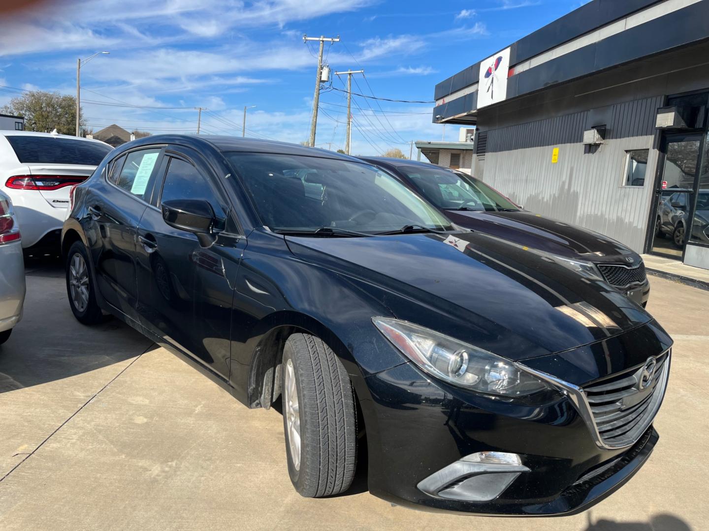 2014 BLACK MAZDA MAZDA3 I TOURING W/S i Touring AT 5-Door (3MZBM1L75EM) with an 2.0L L4 DOHC 16V engine, 6-Speed Automatic transmission, located at 8101 E. Skelly Dr., Tulsa, OK, 74129, (918) 592-3593, 36.121891, -95.888802 - Photo#3